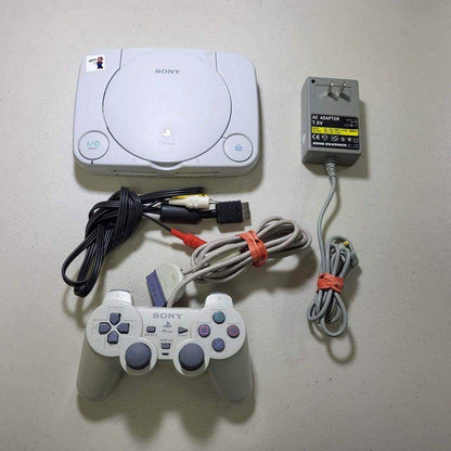 White Console PlayStation System PS1 Slim (Dualshock) -- Jeux Video Hobby 